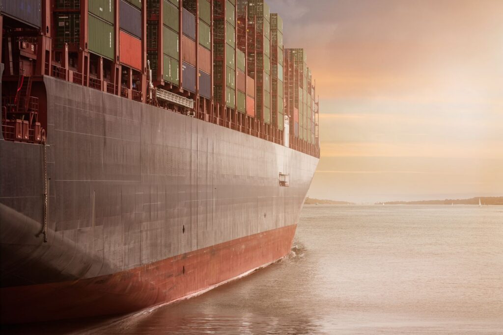 Cargo containers stacked at a busy international shipping port