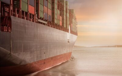 Cargo containers stacked at a busy international shipping port