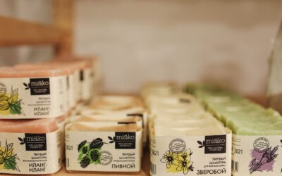 Skincare products arranged on a shelf with custom branded labels