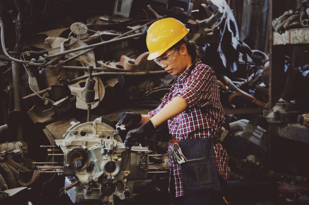 Engineer reviewing injection moulding production inside a Chinese manufacturing facility