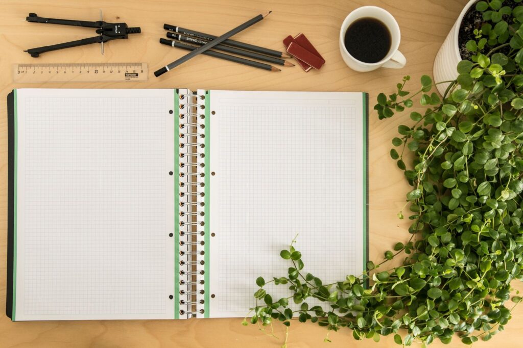 Open compliance notebook and documents on a desk representing import customs paperwork